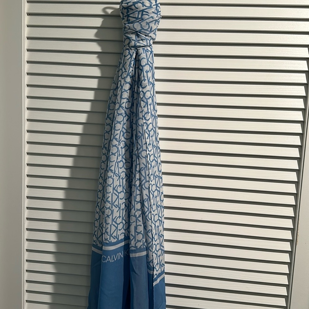 NWT Calvin Klein Long Scarf in baby blue and white with Calvin Klein all over.